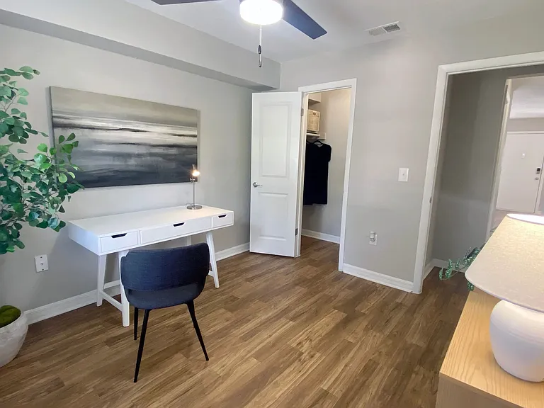 Elevate your work-from-home experience in a second bedroom turned office, complete with a large walk-in closet for efficient storage.