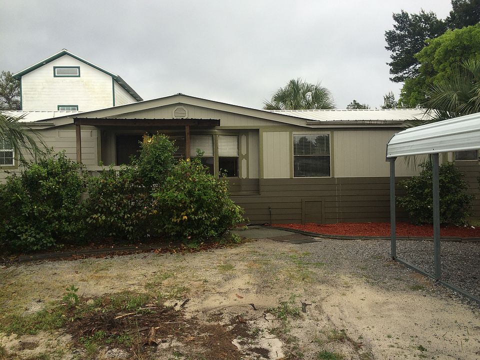 Front of house. Recently painted and new cement siding.