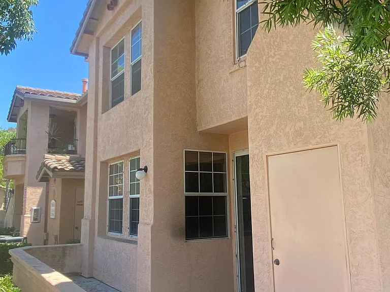 Corner townhome with large patio.