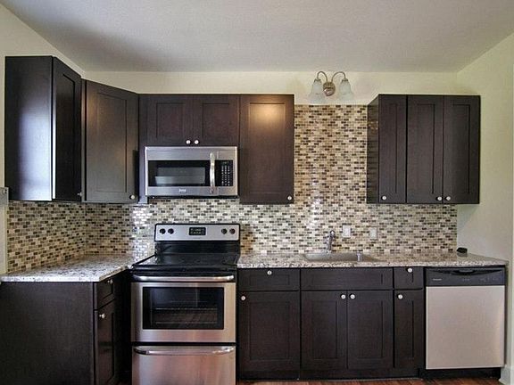 Kitchen with beautiful granite, new cabinetry and stainless