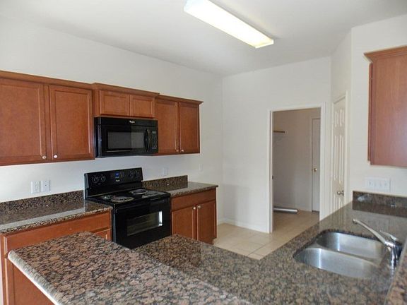 Granite kitchen counters and breakfast bar.
