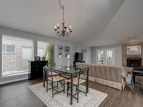 There is a dining/living combo withe nice high ceilings, tile-wood floors and lots of natural sunlight!