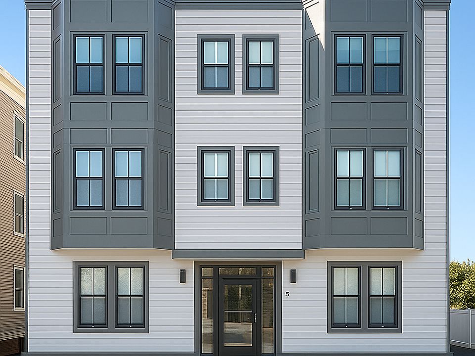 front of the apartment building. outdoor space on side and in back. Private deck.