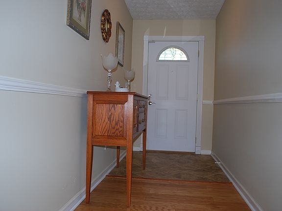 Ceramic tile-hardwood foyer