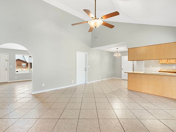 Family room & kitchen with lofted ceiling