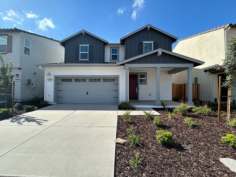 Home Front View (East Facing), wide porch with farmhouse look.