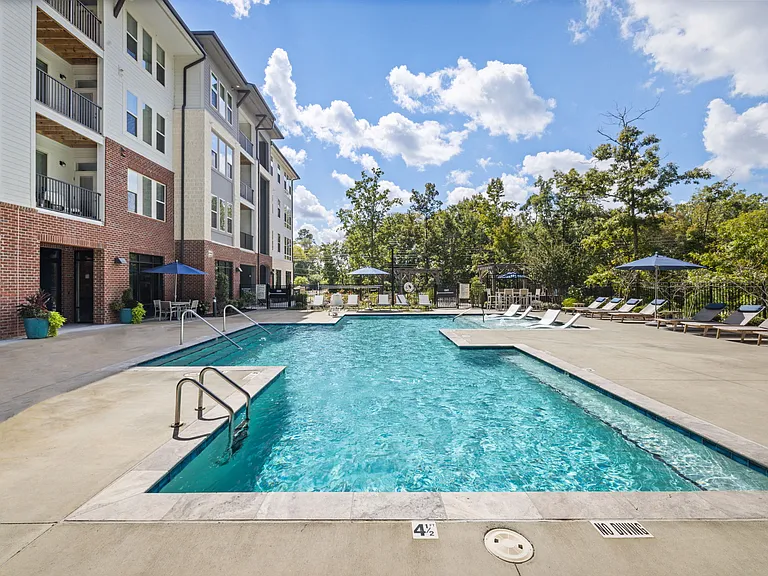 Modern Apartment Pool Area with Sun Shelf and Ample Deck Seating