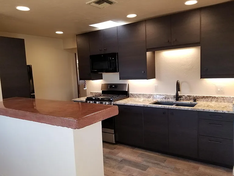 New, well lit kitchen with 40" executive height uppers.