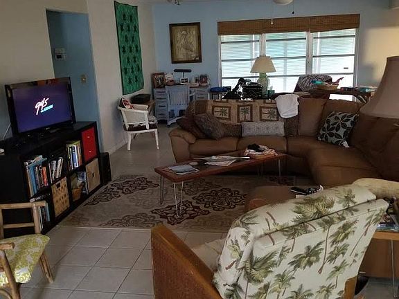 Large open living room, sitting areas.