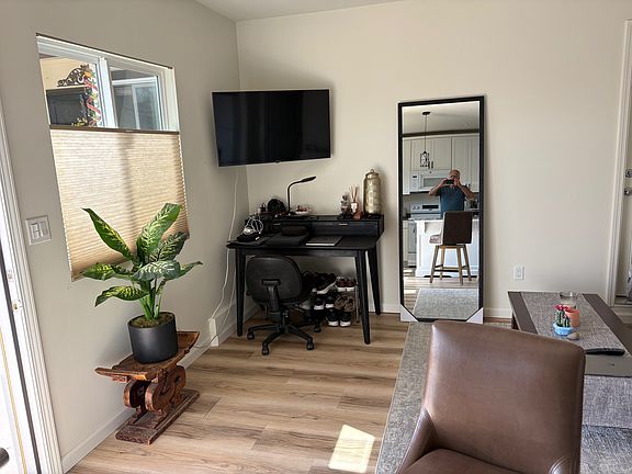Front door and two east-facing windows bring in the morning light to the living room and kitchen