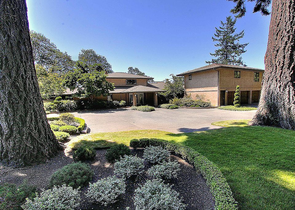 Over 1 acre of beautifully landscaped grounds in a park-like setting.