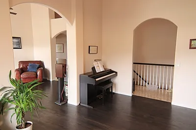 Looking through office space to Living Room and Hallway to Kitchen- to the right/ primary bedroom to the left