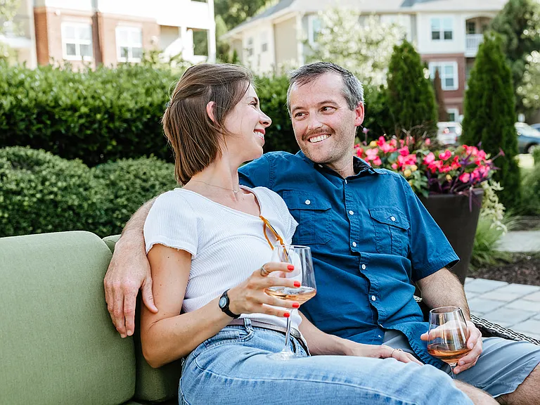 Residents enjoying outdoor lounge seating