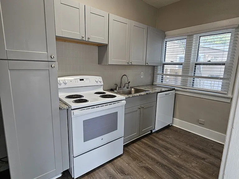 Brand new kitchen with granite countertops.