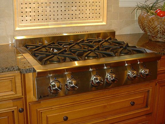 Cooks delight with 6 burner gas range highlighted marble mosaic splash