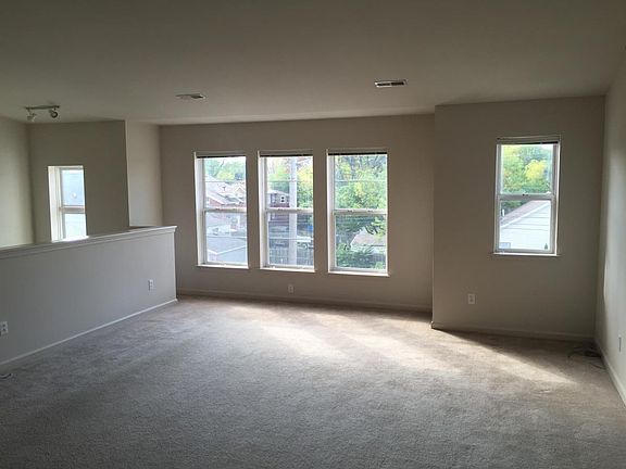 Open concept living room with high ceilings