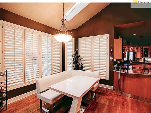Spacious breakfast room with plantation shutters and access to the large deck.