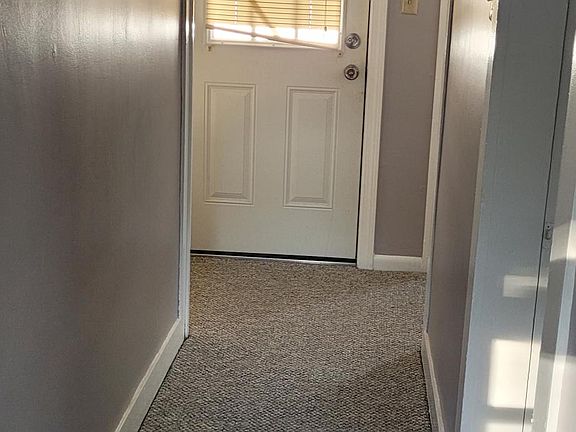 Hallway to master and kitchen