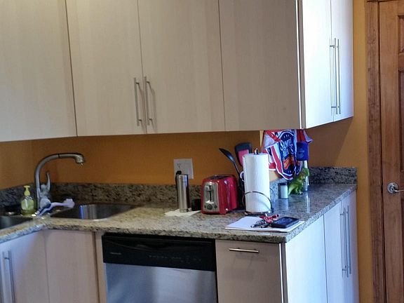 High ceiling with high cabinetry in kitchen