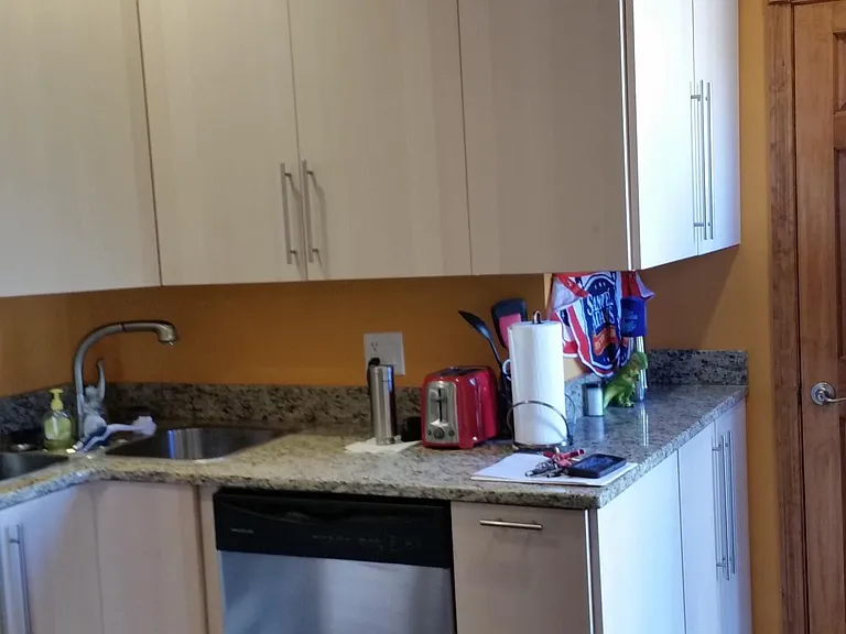 High ceiling with high cabinetry in kitchen