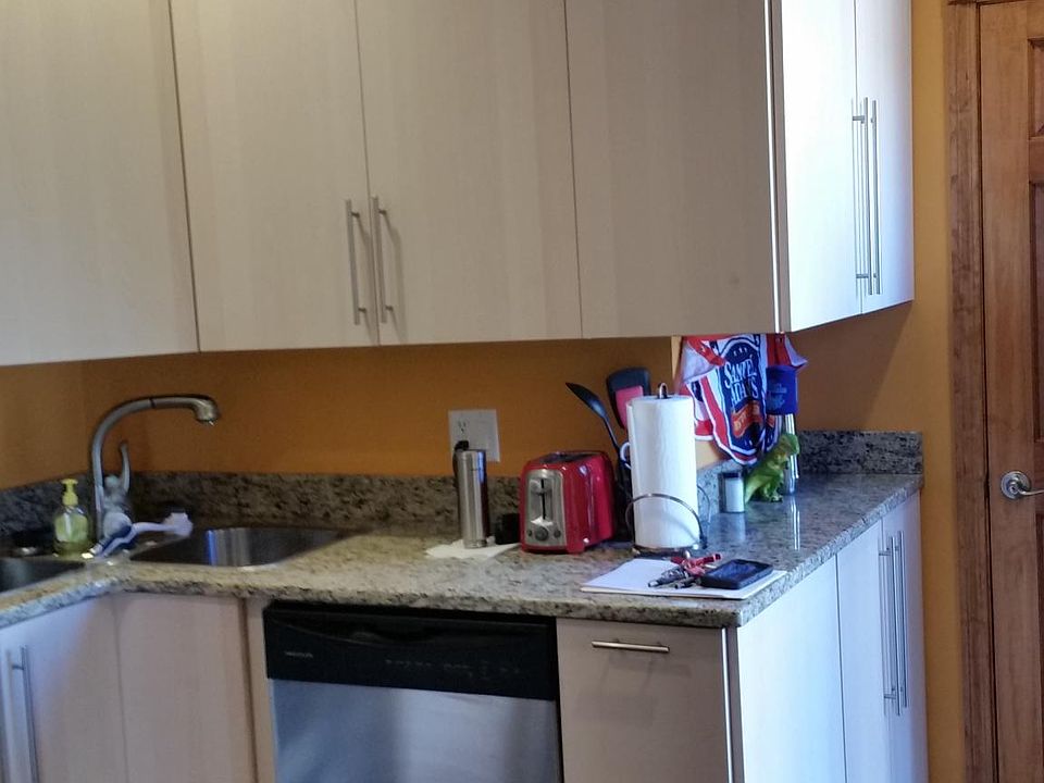 High ceiling with high cabinetry in kitchen