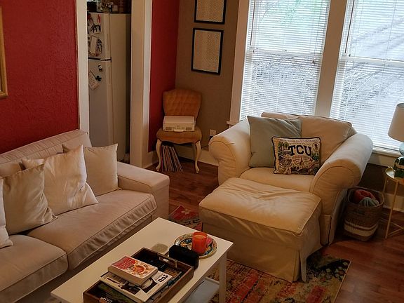 Example of how your living room layout might be. Walls have been painted a neutral white since this photo was taken. (No more red accent walls.)