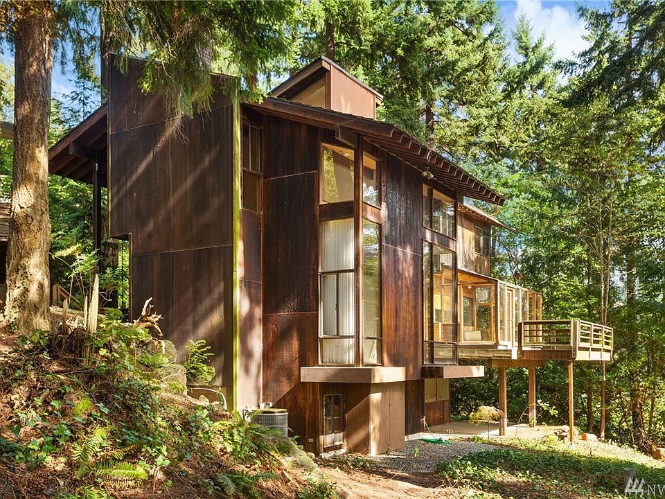 1968 Mid Century Inspired home custom architectural home located in Medina, WA.  Wondeful windows take full advantage of the natural landscape and lake views.