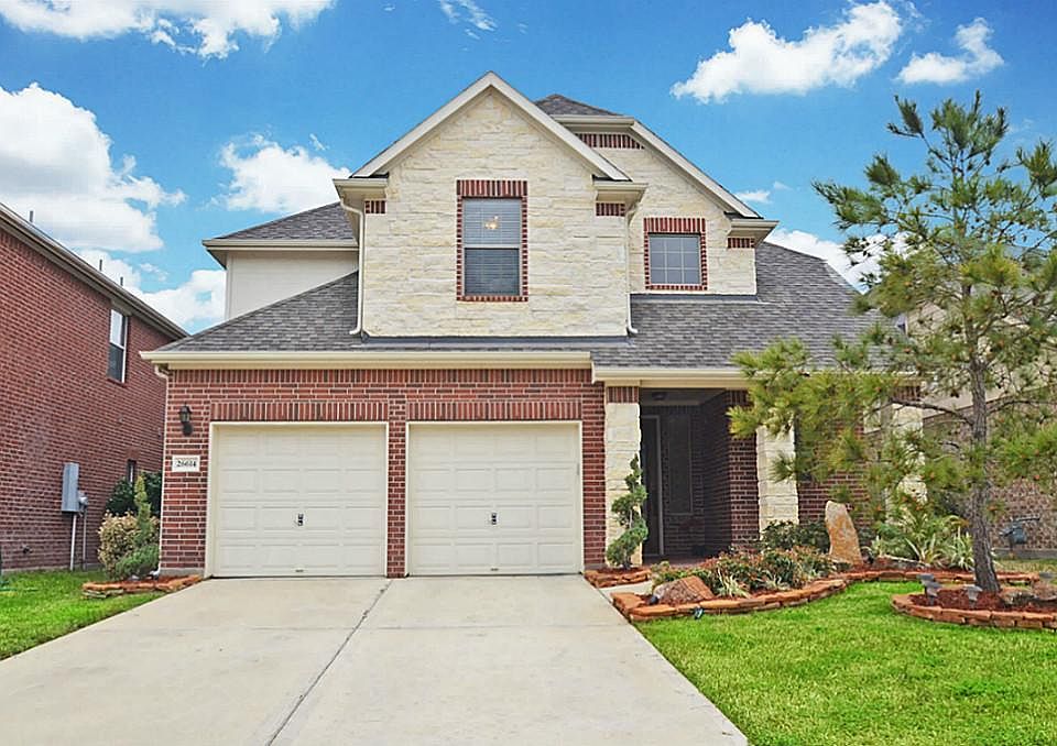 WELCOME HOME! THE STONE EXTERIOR AND BEAUTIFUL LANDSCAPING SETS THIS HOME APART FROM THE REST