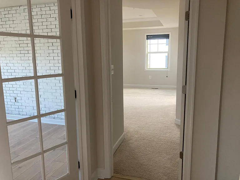 Upstairs hallway leads into master bedroom