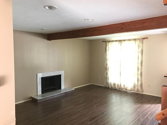 Living room w working wood burning fireplace