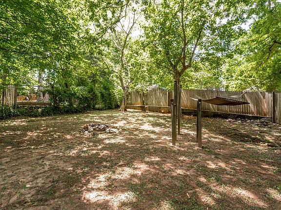 A large backyard shared with two other units. Just need someone to start a garden!