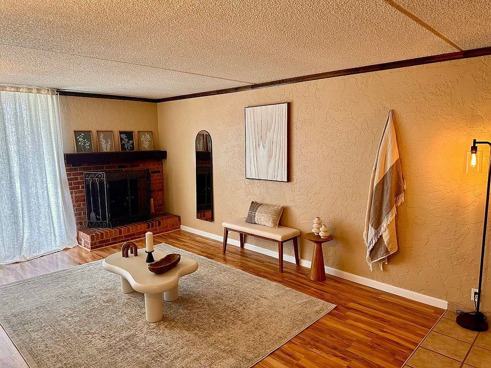 Living area with fireplace and access to large private balcony on the 3rd floor