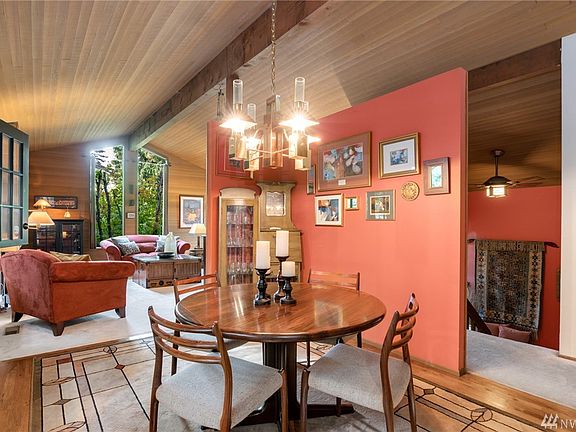 Defined spaces offering a formal living room & dining room.