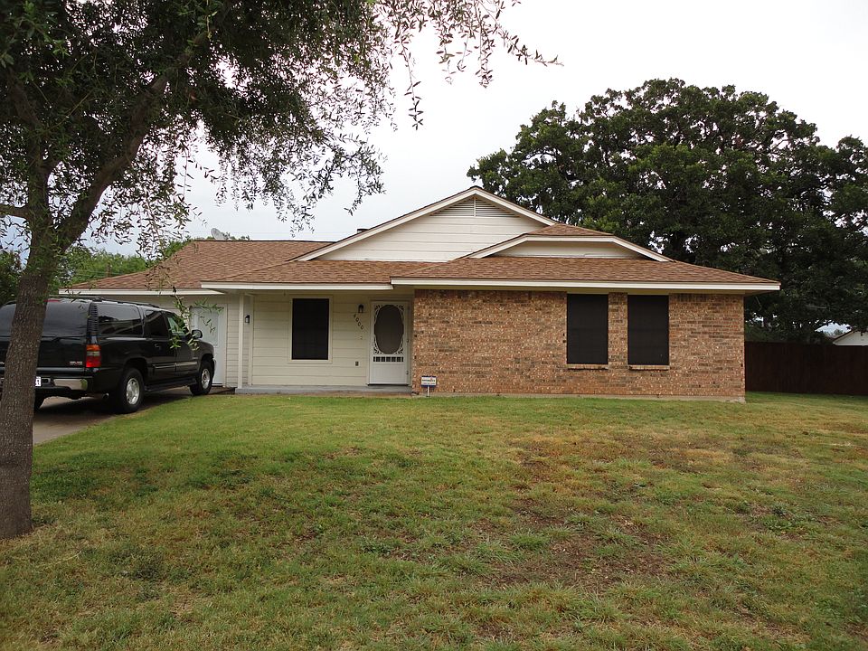 Front of home. Solar screens on windows. Converted garage has own entrence. 