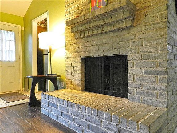 Wood burning fireplace in family room.