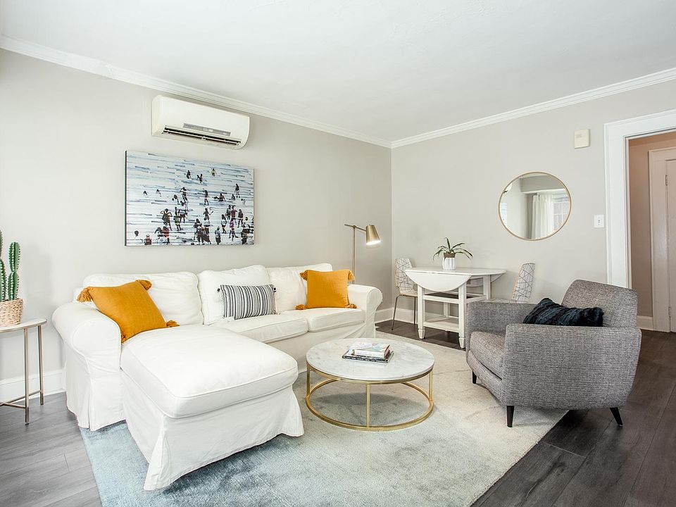 Bright living room with room for a dining area.