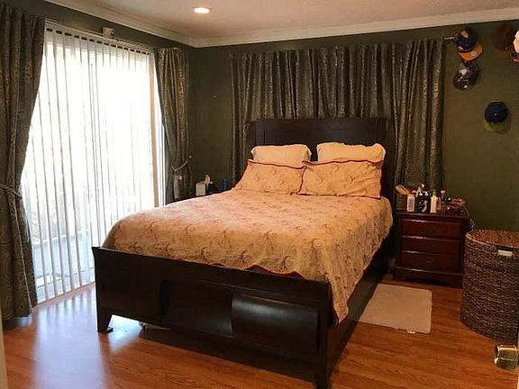 master bedroom with wood floors
