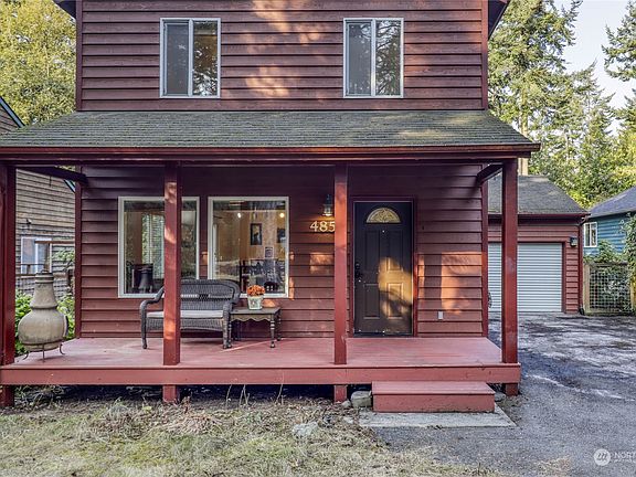 The house has a welcoming front porch.  >