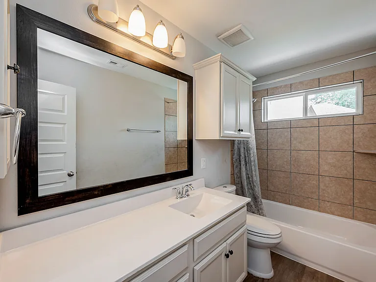 Large bathroom upstairs even includes built in medicine cabinets and plenty of storage plus extra linen closet right outside door