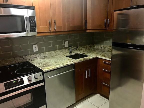 Updated kitchen with granite countertops and subway tile