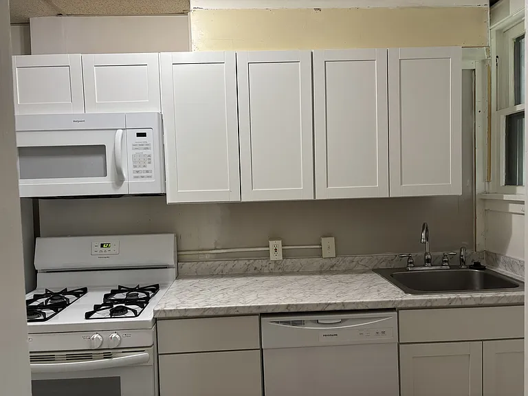 Brand new kitchen cabinets, dishwasher, and microwave