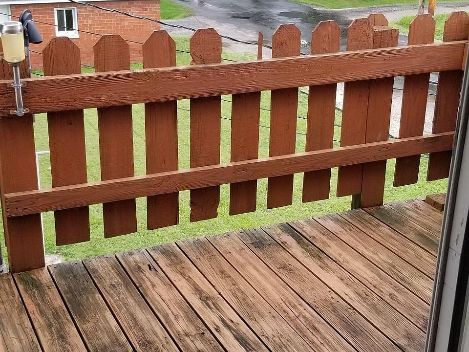 Main Entrance with Deck Overlooking the yard