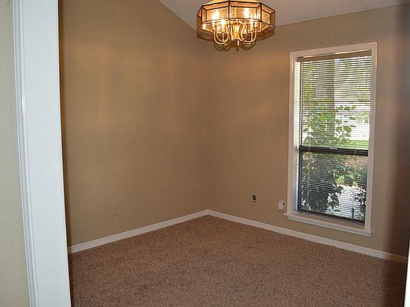 The formal dining room is in the front of the house and could easily double for an office.