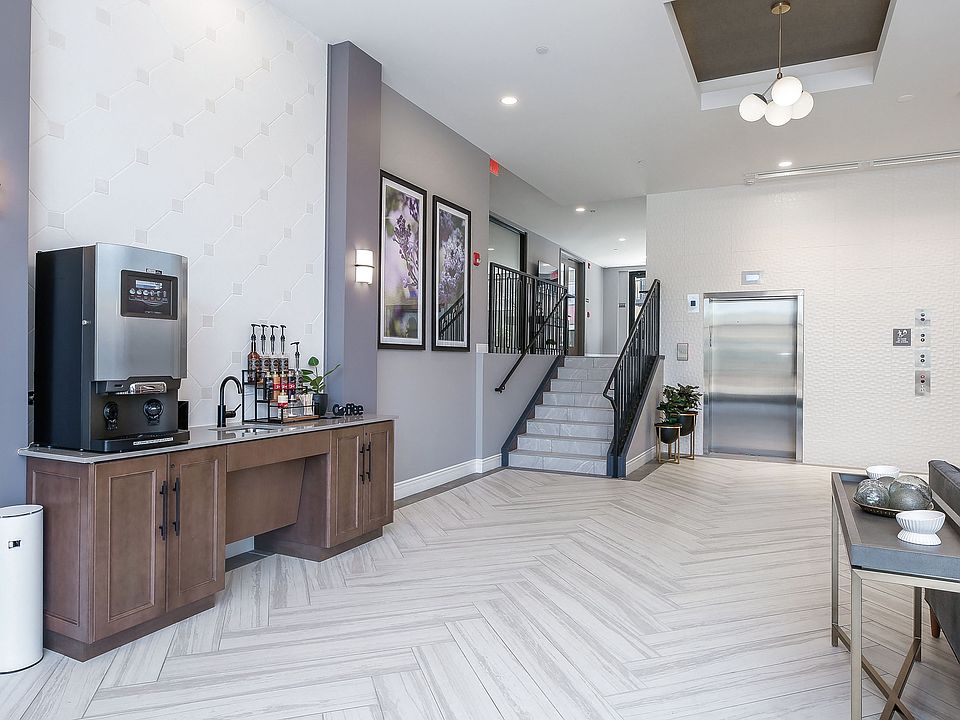 Hotel Style lobby with complimentary coffee bar, fireplace, seating and computer/printer
