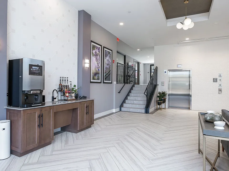 Hotel Style lobby with complimentary coffee bar, fireplace, seating and computer/printer