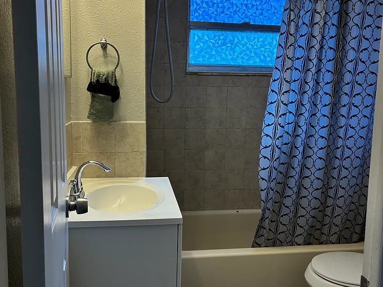 Full bathroom adjacent to first floor bedroom.