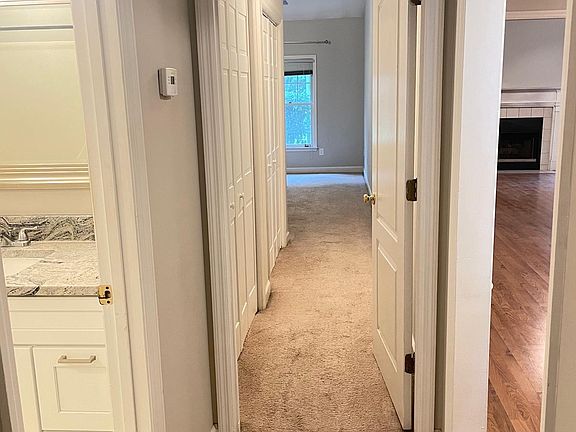 Hallway with lots of storage closets.