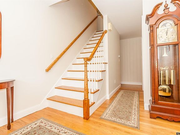 Step in from the front porch to the bright foyer with hardwood floors.
