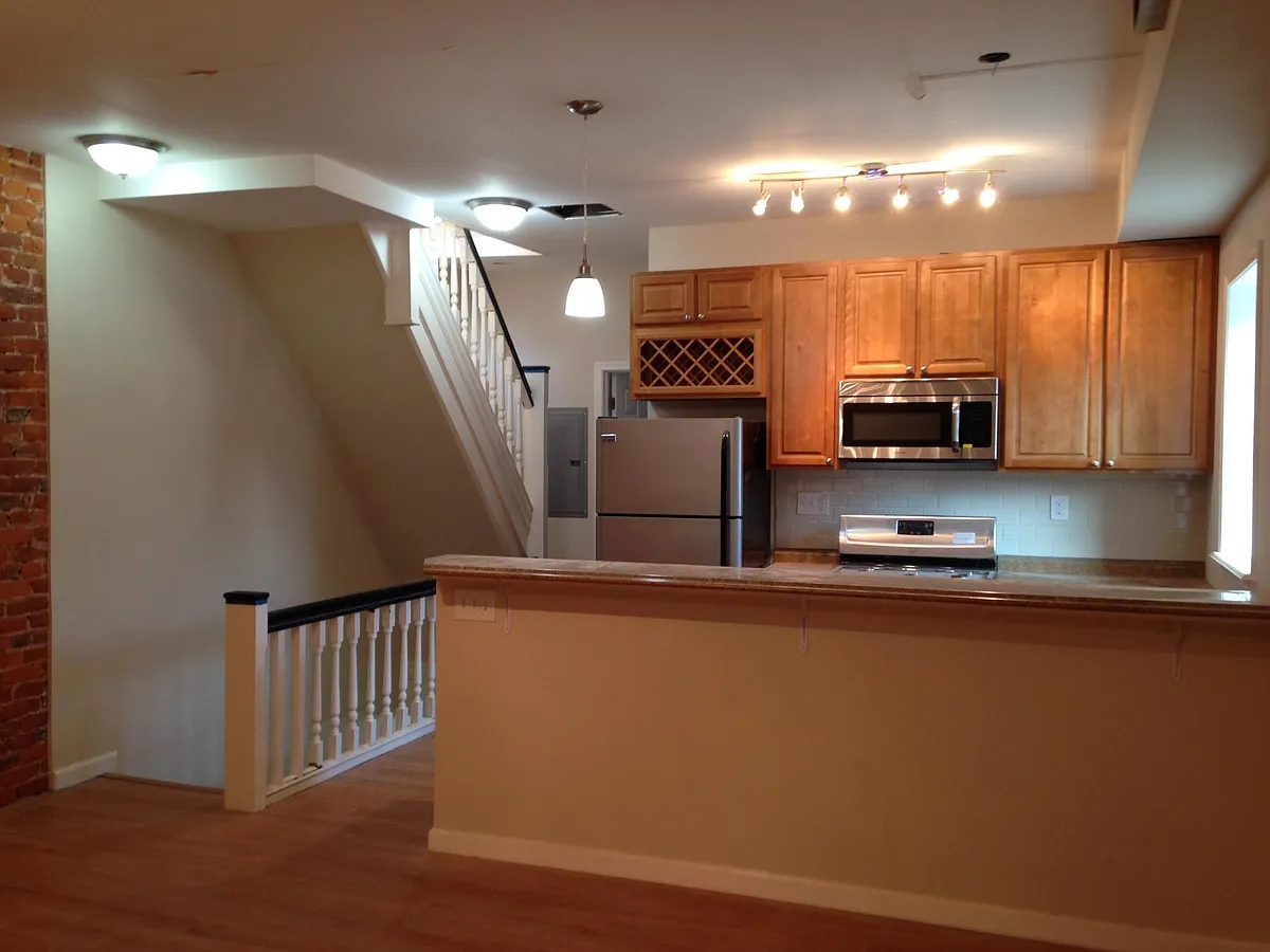 View of kitchen with stairs to 3rd floor - 701 S 51st St #2