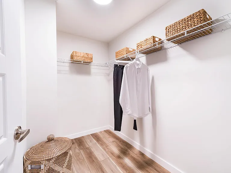 A spacious closet at Modera Aventura with open shelving and clean lines, offering an organized, streamlined space that supports everyday living.